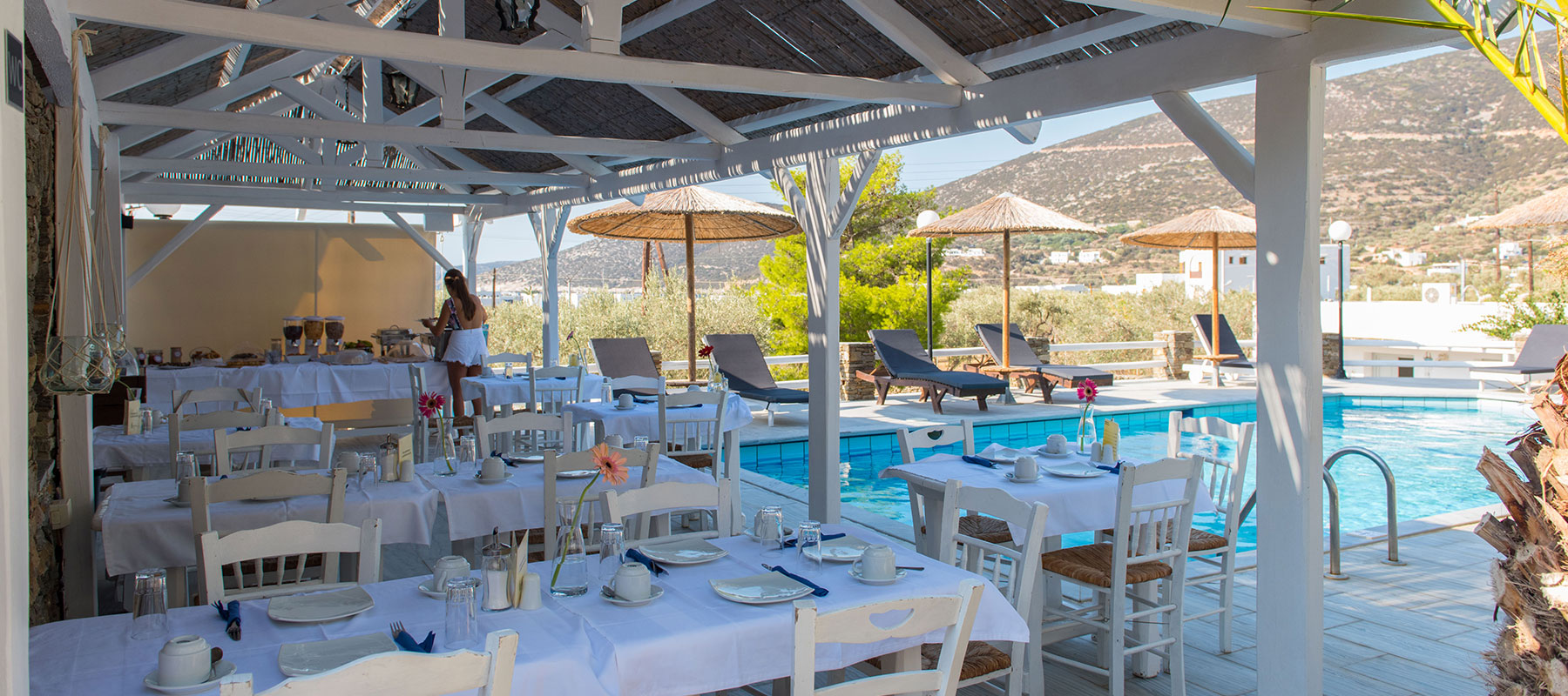 Breakfast area by the pool at Villa Irini in Platis Gialos